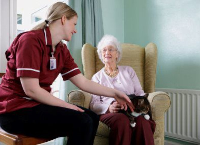 caregiver talking to senior woman