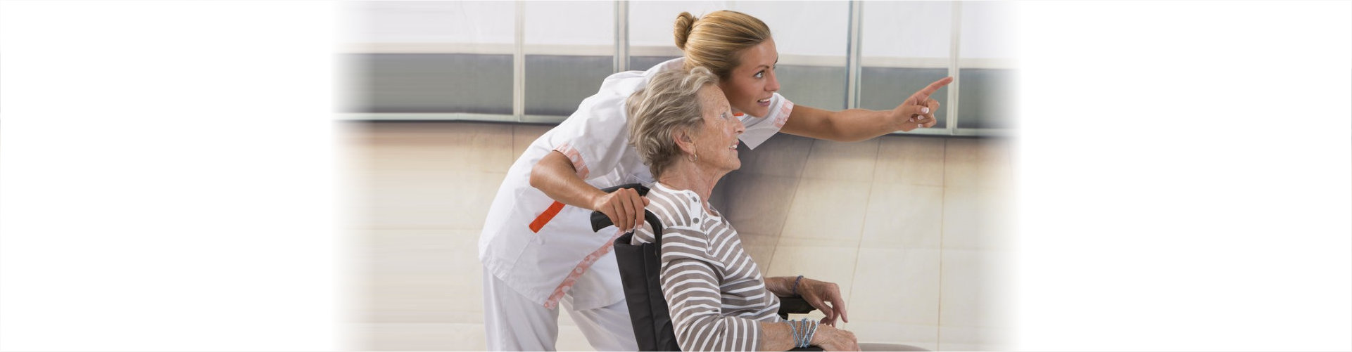 caregiver showing something to senior woman