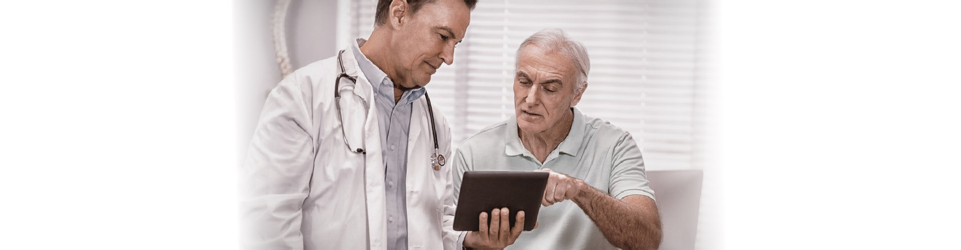 doctor reminding senior man about his medication