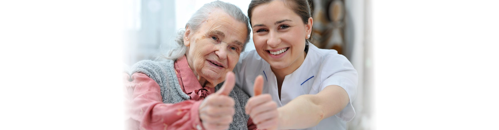 caregiver and senior woman smiling